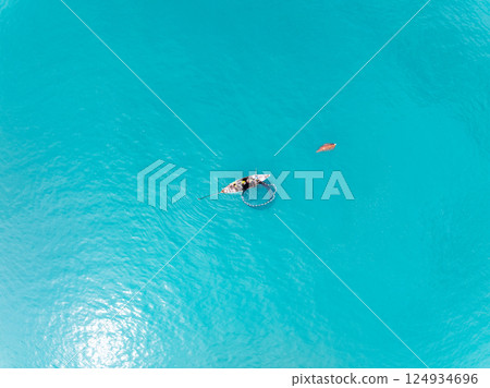 Sea surface aerial view,Bird eye view photo of waves water surface texture,Summer sea background,Beautiful nature Amazing view sea background 124934696