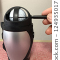 Rotate the golf ball, find the center of gravity, and draw the center line 124935017