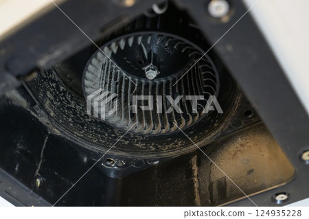 Ventilation fan being disassembled and cleaned (bathroom) 124935228