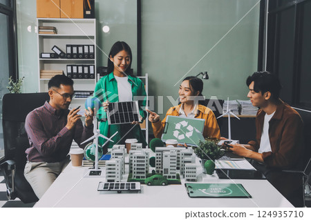 Asian business people team brainstorm meeting in green corporate office. Presentation ESG project planning. Environmental conservation, responsible business, sustainable development goal concept 124935710