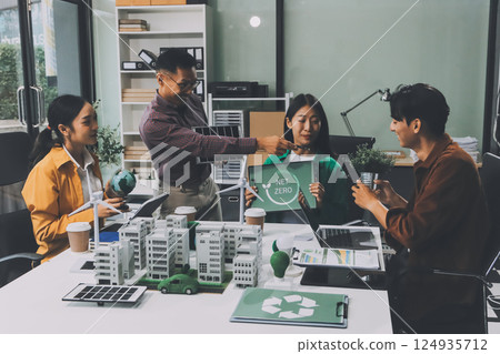 Asian business people team brainstorm meeting in green corporate office. Presentation ESG project planning. Environmental conservation, responsible business, sustainable development goal concept 124935712