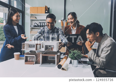 Construction, planning and architects meeting about design of building, strategy and working in industrial collaboration. Architecture workers talking about maintenance project with paper and a model 124935716