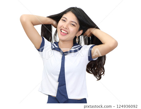 young woman in japanese student cosplay uniform on white background young woman in japanese student cosplay uniform on white background 124936092