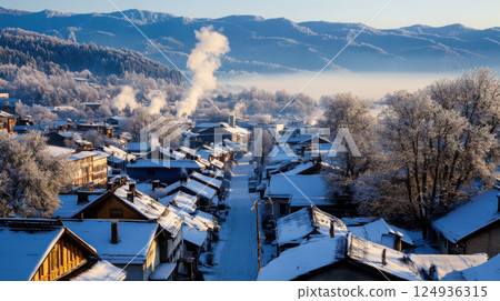 serene mountain village blanketed in snow, with smoke rising from chimneys serene mountain village blanketed in snow, with smoke rising from chimneys 124936315