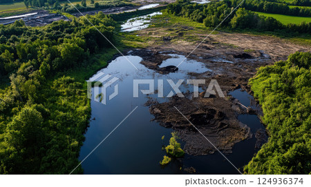 once green meadow now turned into toxic waste dump, showcasing environmental damage once green meadow now turned into toxic waste dump, showcasing environmental damage 124936374