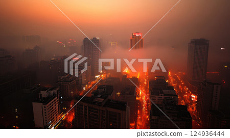 modern metropolis shrouded in fog with glowing neon lights at dusk 124936444