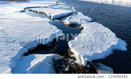 Melting ice formations create stunning contrast with dark water Melting ice formations create stunning contrast with dark water 124936561