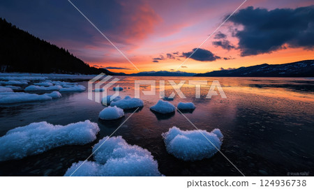 serene lake at sunset with ice formations and colorful sky serene lake at sunset with ice formations and colorful sky 124936738