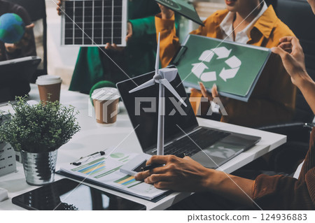 Asian business people team brainstorm meeting in green corporate office. Presentation ESG project planning. Environmental conservation, responsible business, sustainable development goal concept 124936883