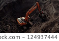 giant excavator removing layers of earth in deep pit, showcasing heavy machinery 124937444
