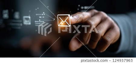 hand touching email icon on screen with digital effects, symbolizing communication 124937963