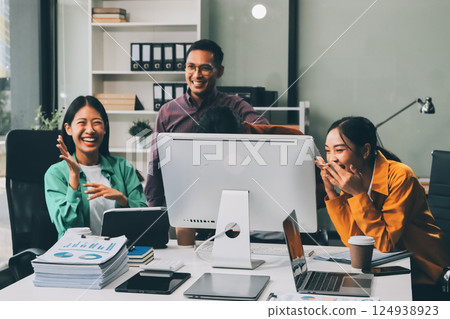 Business team showing unity with their hands together, Close up top view of young business people putting their hands together. people together to work as team to ensure the success of the business 124938923