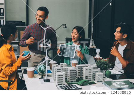 Asian business people team brainstorm meeting in green corporate office. Presentation ESG project planning. Environmental conservation, responsible business, sustainable development goal concept 124938930