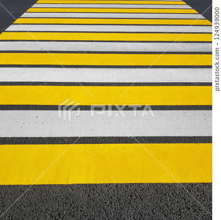 Freshly painted pedestrian crossing with yellow and white markings on asphalt, vertical photo, sunlight Freshly painted pedestrian crossing with yellow and white markings on asphalt, vertical photo, sunlight 124939000