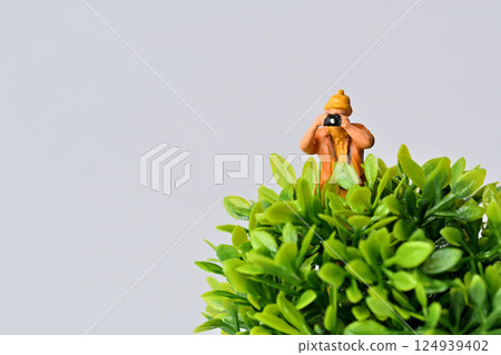 A woman taking a picture with a camera 124939402