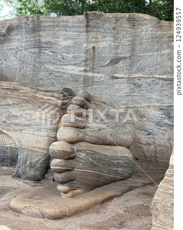 Feet of the reclining Buddha statue at Gal Vihara, patterns carved on the soles of the feet, World Heritage Site Feet of the reclining Buddha statue at Gal Vihara, patterns carved on the soles of the feet, World Heritage Site 124939557