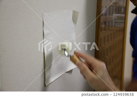 Repairing a hole in a wall Repairing a hole in a wall 124939638