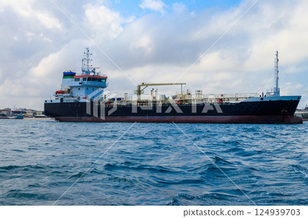 Large industrial ship sailing in the Indian ocean near Zanzibar, Tanzania Large industrial ship sailing in the Indian ocean near Zanzibar, Tanzania 124939703