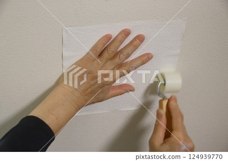 Repairing a hole in a wall Repairing a hole in a wall 124939770