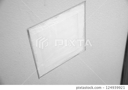 Repairing a hole in a wall (monochrome) 124939921