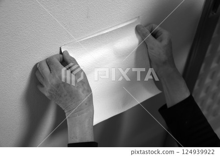 Repairing a hole in a wall (monochrome) Repairing a hole in a wall (monochrome) 124939922