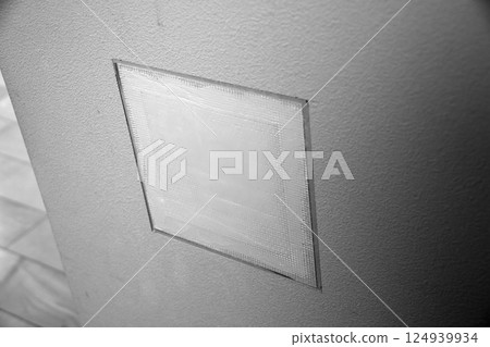 Repairing a hole in a wall (monochrome) 124939934