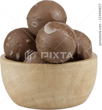 chocolate balls in wooden cup. chocolate balls in wooden cup. 124940657