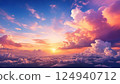 A dreamlike aerial paradise: A golden sunset over a sea of clouds and a fantastic pink-purple sky 124940712