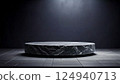 Luxurious black marble display: sophisticated circular base and fantastic spotlights 124940713