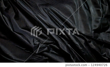 Shiny Black Leather Texture - Abstract background of the drape and texture of luxurious glossy black leather material Shiny Black Leather Texture - Abstract background of the drape and texture of luxurious glossy black leather material 124940726