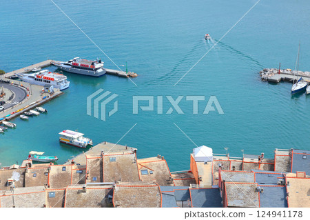 Yachts, boats in bay of Porto Venere, Liguria. Sea and tourism in Italy. Traditional buildings. Background for design.  124941178