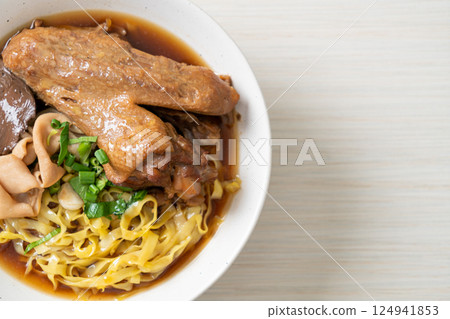egg noodles with stewed and braised duck in brown soup egg noodles with stewed and braised duck in brown soup 124941853