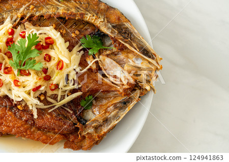 Fried Sea Bass Fish with Fish Sauce and Spicy Salad Fried Sea Bass Fish with Fish Sauce and Spicy Salad 124941863