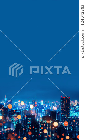 A vibrant cityscape at night with blurred lights creating a mesmerizing bokeh effect. The urban environment glows with streetlights and neon signs, capturing the essence of nightlife and movement 124942883