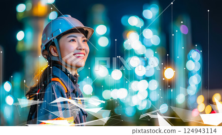 Modern female worker gazing into the distance in an industrial facility, Industry 4.0 124943114