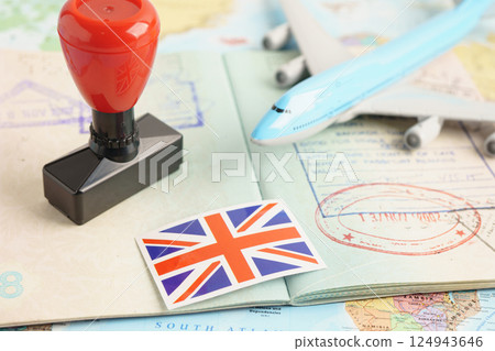 UK United Kingdom passport with approved stamp on document for tourism to immigration at airport in country. 124943646