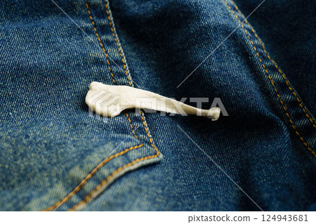 Dirty chewing gum stain removal on cloth jean accident to wash with washing powder, cleaning housework. Dirty chewing gum stain removal on cloth jean accident to wash with washing powder, cleaning housework. 124943681