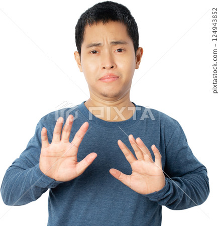 Asian young man showing stop gesture. Asian young man showing stop gesture. 124943852