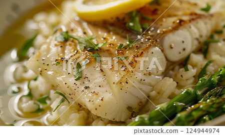 Champagne Turbot Meunieere: Tender turbot in champagne, lemon, and browned butter with creamy risotto or asparagus. 124944974
