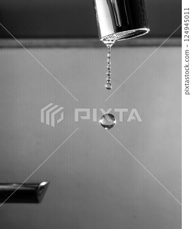 Frozen Moment of a Dripping Faucet 124945011