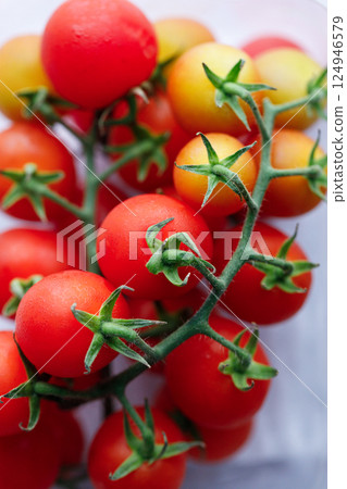 Fresh red cherry tomato on white background. 124946579