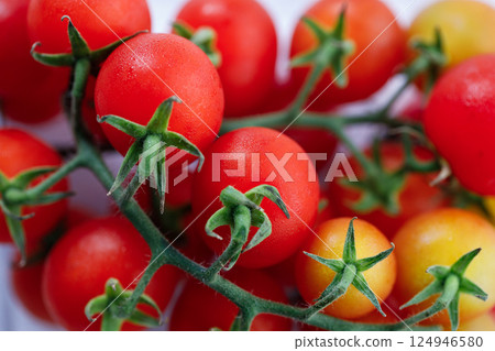 Fresh red cherry tomato on white background. 124946580