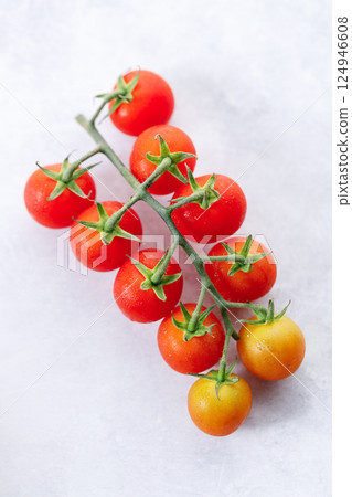 Fresh red cherry tomato on white background. Fresh red cherry tomato on white background. 124946608