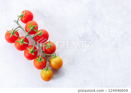 Fresh red cherry tomato on white background. Fresh red cherry tomato on white background. 124946609