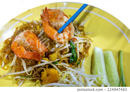 Top view of Prawn Pad Thai in yellow dish, focus selective Top view of Prawn Pad Thai in yellow dish, focus selective 124947483