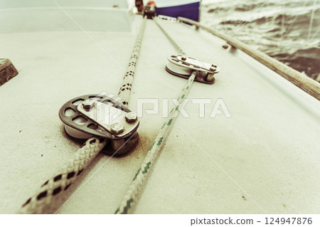 Detailed closeup of rigging on sail boat Detailed closeup of rigging on sail boat 124947876