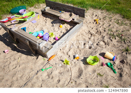 Childhood. Sandpit sandbox with toys on playground. 124947890