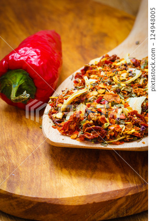 Colored spices for pasta mix on wooden spoon Colored spices for pasta mix on wooden spoon 124948005