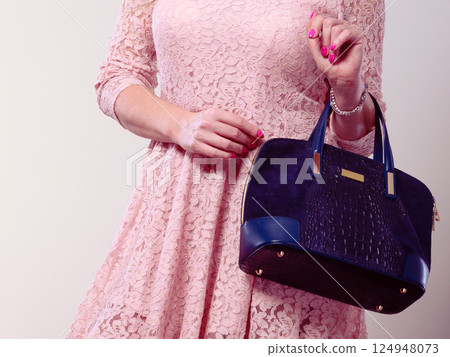 Part body woman in dress with bag. 124948073
