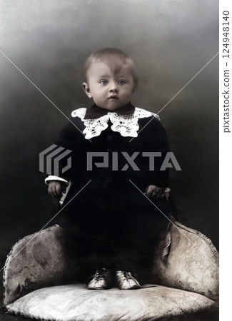 Vintage portrait of a cute little boy standing in a chair. USSR, Voronezh. Retro photo 1935 124948140